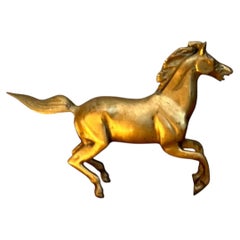 Caballo al galope de latón vintage
