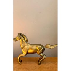 Caballo al galope de latón vintage