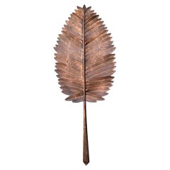 Œuvre d'art vintage en métal représentant des feuilles végétales