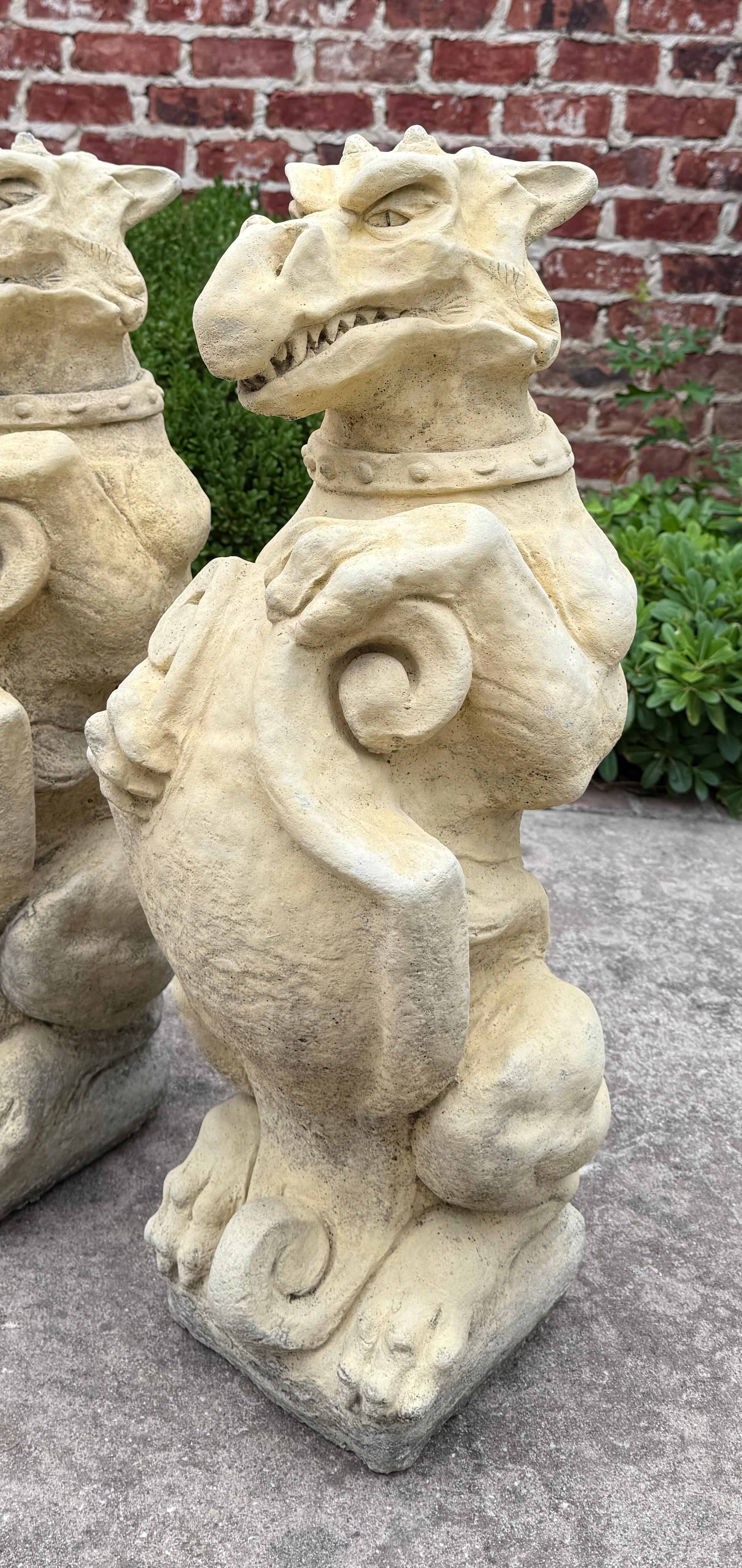 20th Century Vintage English Statues Garden Figures Gargoyles Shield Cast Stone Pair For Sale