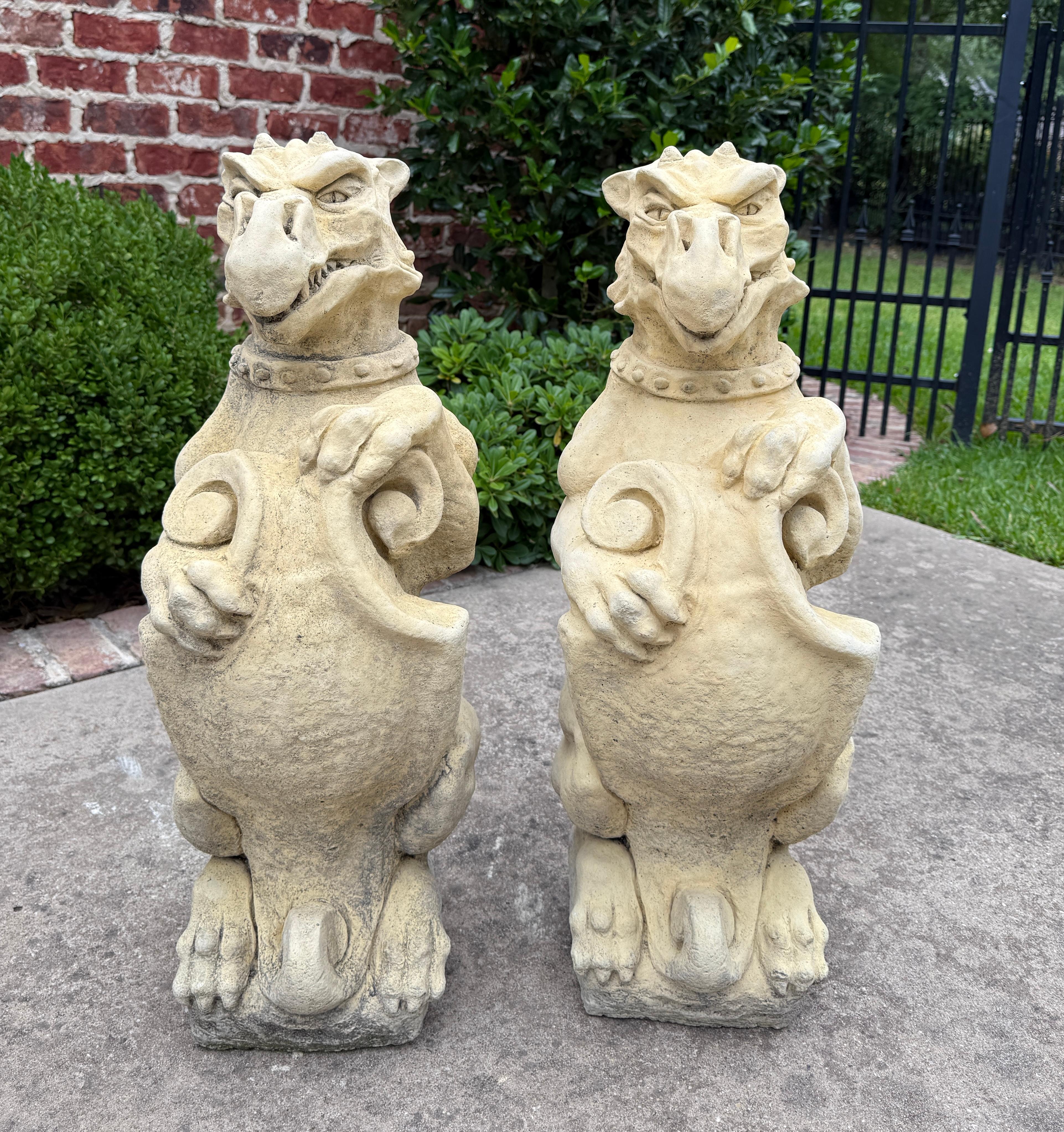 Vintage English Cast Stone Statues PAIR GARGOYLE Garden Figures Yard Decor

Original aged patina sitting on a square base with shields

 The perfect accent piece or focal point in an entryway, garden, yard or flower bed  

Each gargoyle stands 28