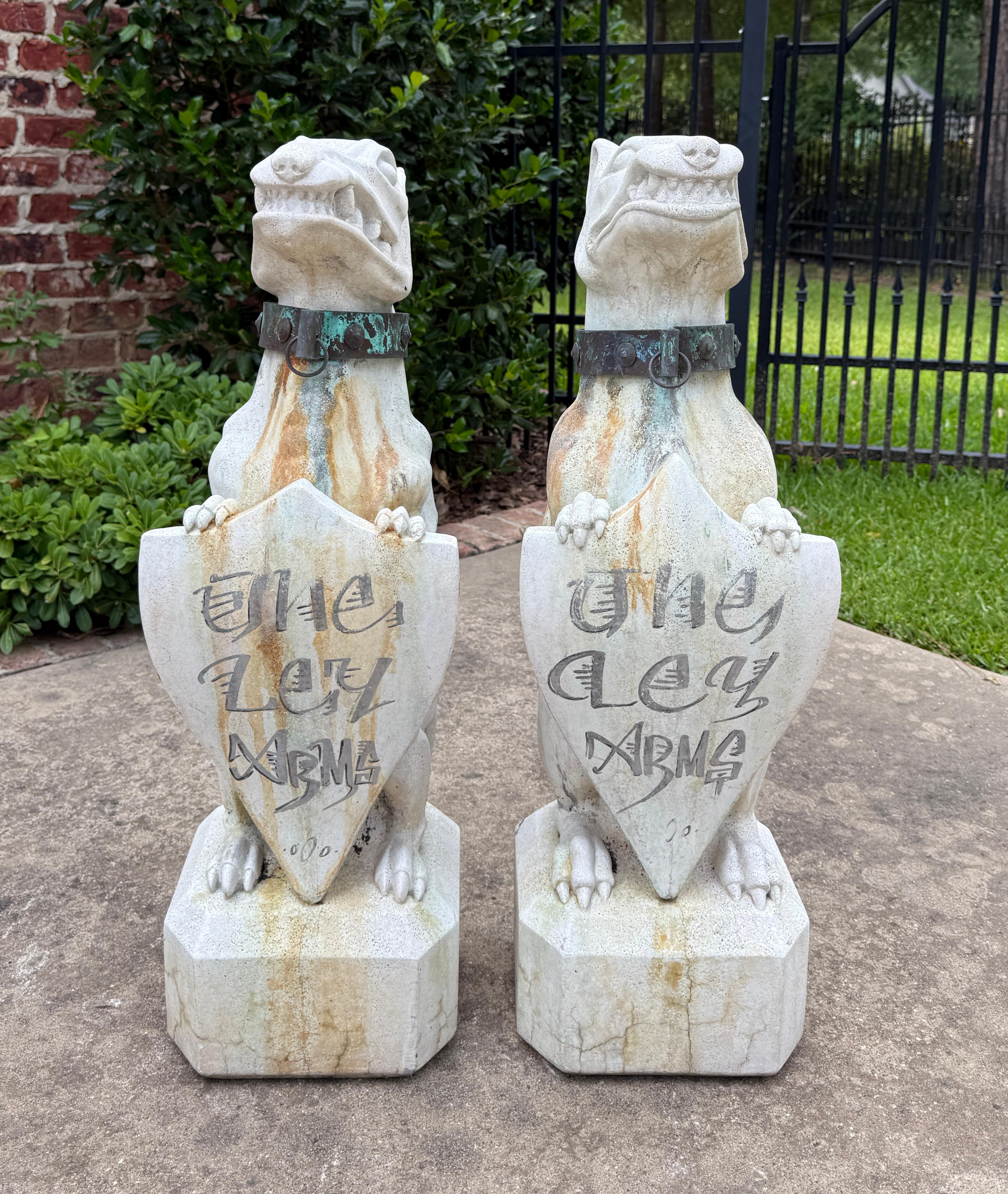 Vintage English Cast Stone Statues PAIR GARGOYLE Garden Figures Yard Decor

Original aged patina with brass collars and shields etched 