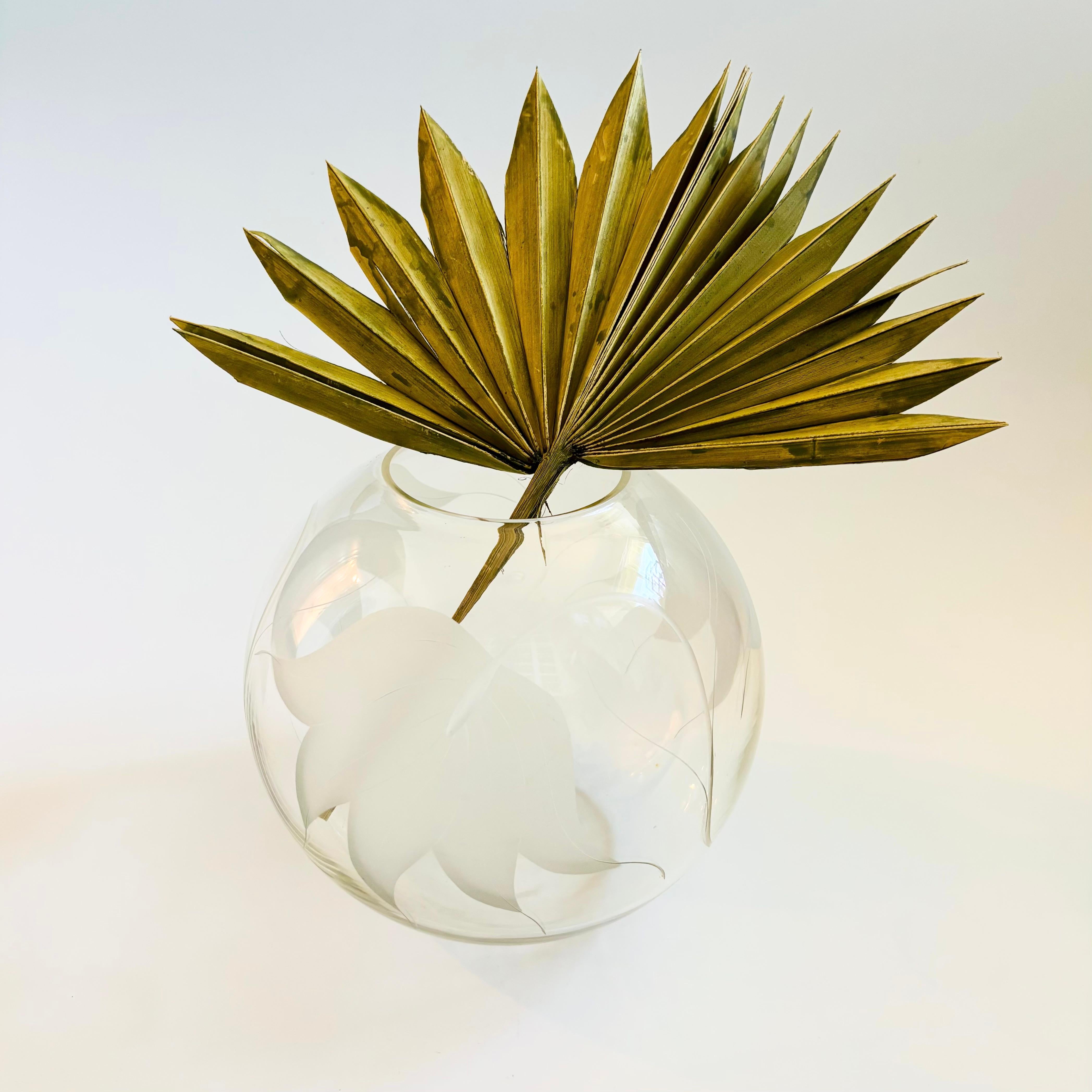 A large vintage glass vase in a simple modern sphere shape. The sides are decorated with a lovely frosted leaf design.

