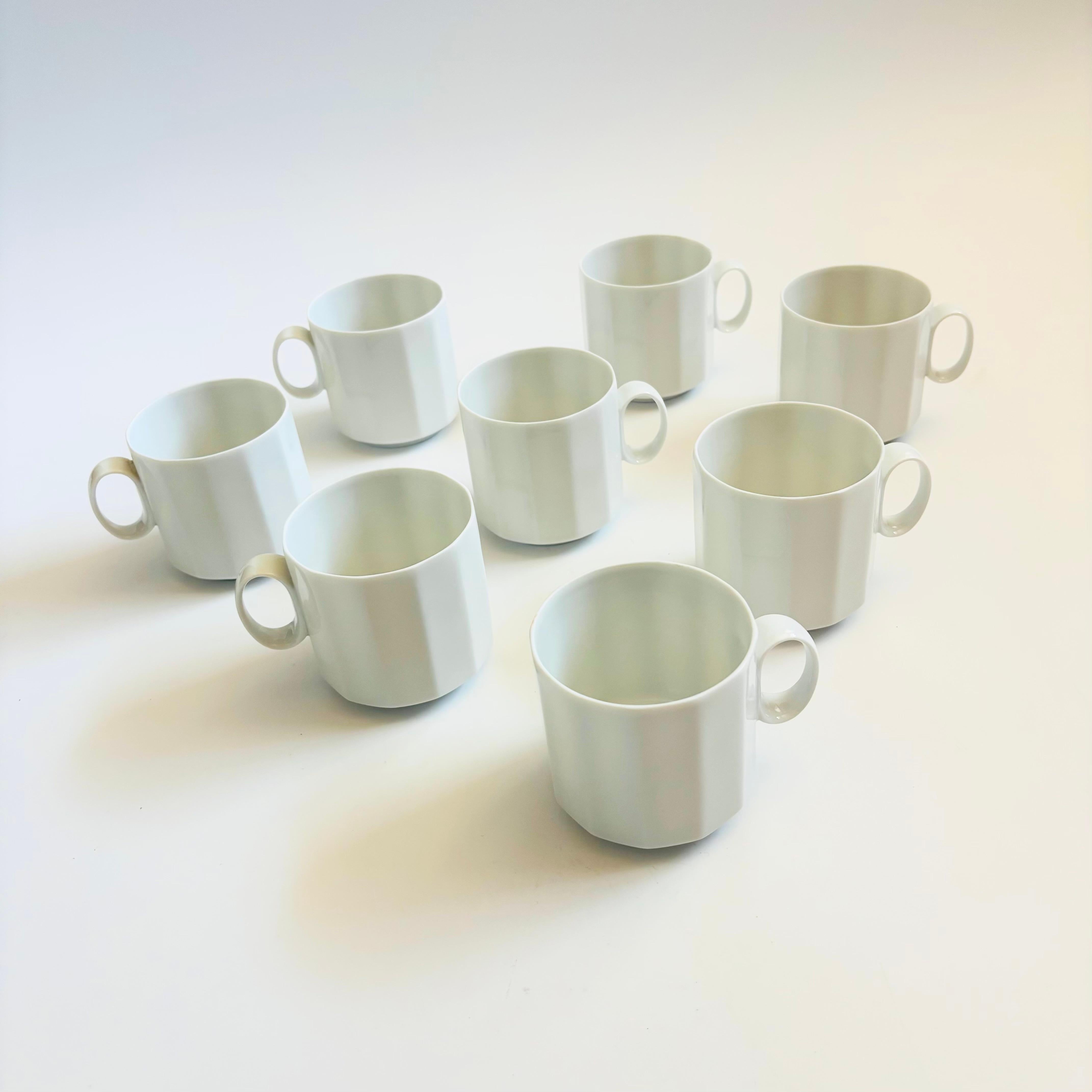 A set of 8 vintage white ceramic mugs. Made in Germany by Rosenthal in the 