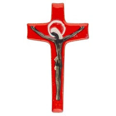 Leuchtend orangefarbenes, glänzendes Kreuz, abstrakte Christusfigur, modernistische religiöse Kunst