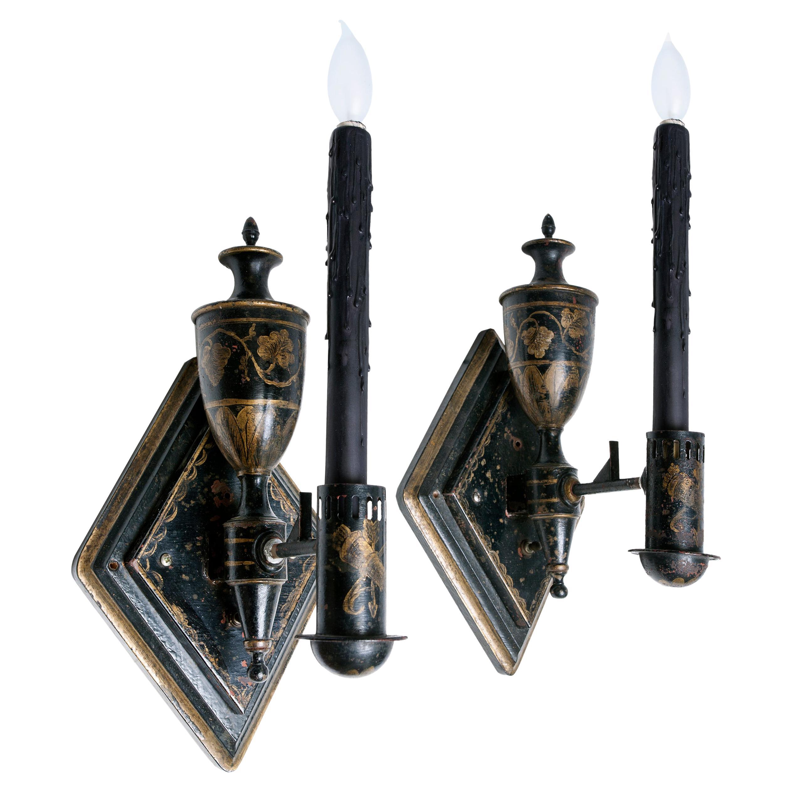 A pair of diamond shaped Italian painted sconces. Newly rewired ready for hardwiring. Custom finished ebony candle covers. The silk shades are not included.