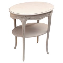 Mesa auxiliar ovalada con tapa de cristal