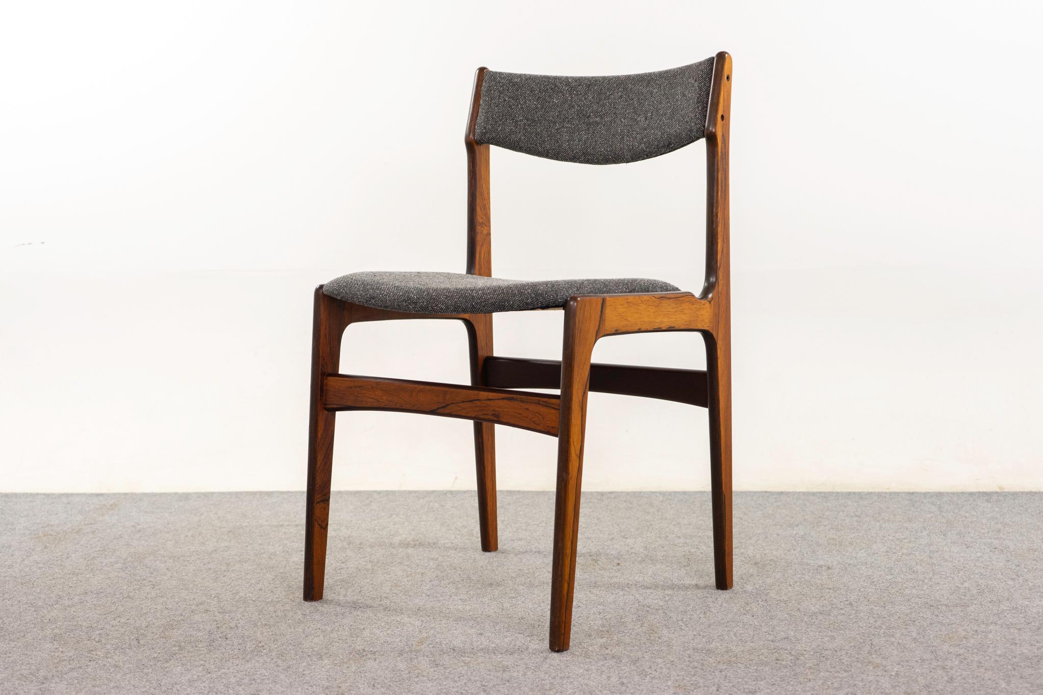 Rosewood mid-century dining chairs, circa 1960's. Lovely grain patterns on the veneer frames, sturdy, yet elegant. Beautifully curved backrests and generous seat size. New upholstery in a salt & pepper grey blend of wool and flax. Rare to have a set