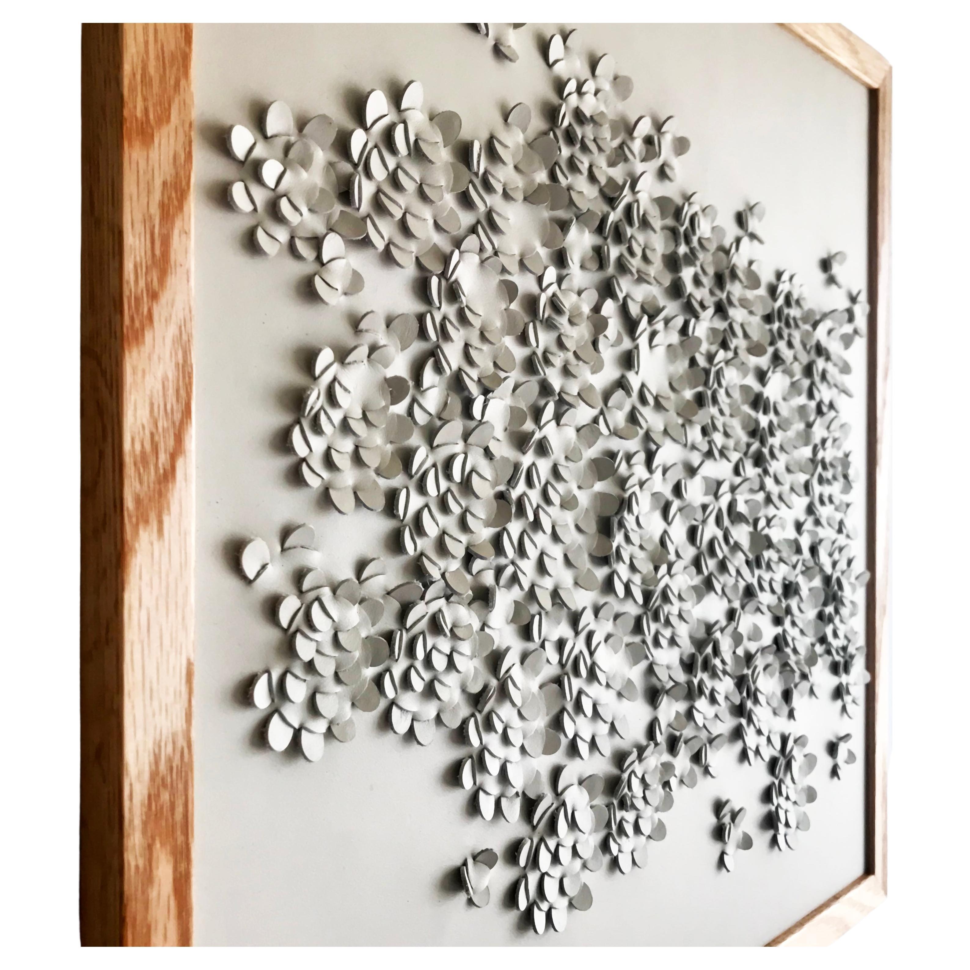 Wild flower:

A piece of 3D sculptural wall art designed and made from two layers of cream leather woven together by Louise Heighes.
Measurements are 19.5 x 19.5 inches or 49 x 49 cm

This piece is inspired by the striking yellow wildflower and