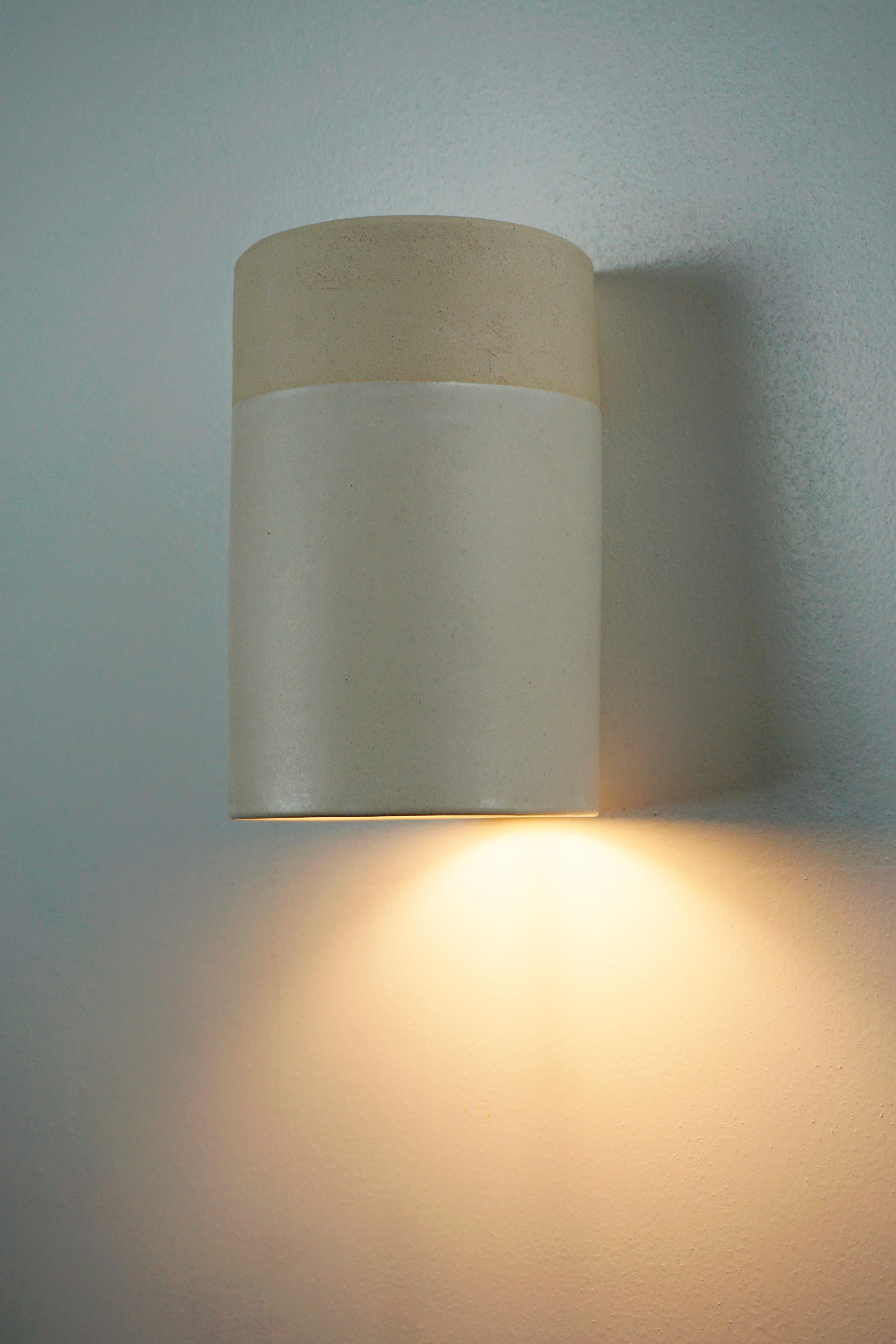 Ceramic hand - crafted wall sconce, designed and signed by Rulo and Manolo Eirin. Interior and exterior vitrified in white, which allows a greater projection of light on the wall. The electrical connection of the lamp is suitable for both the