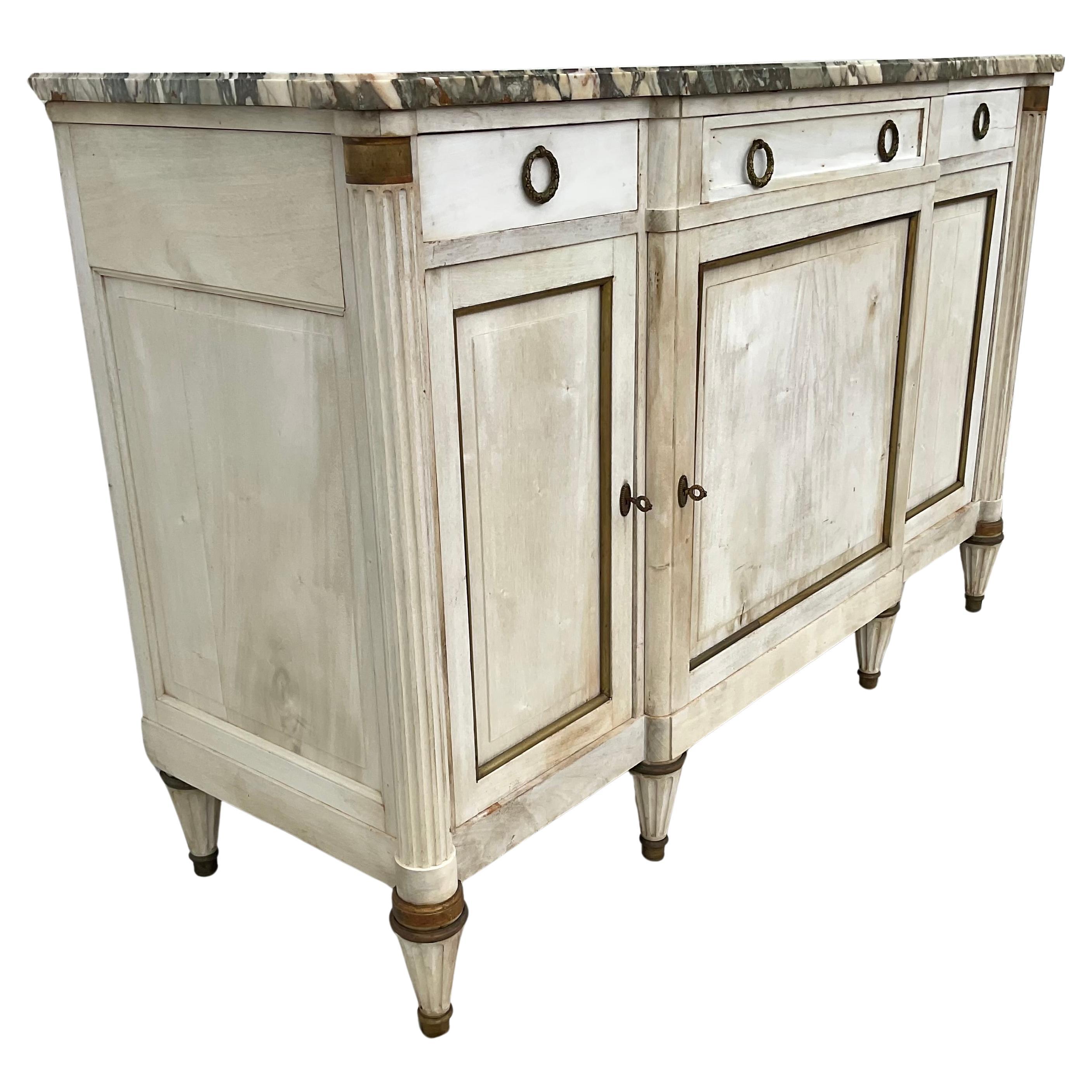 Antique French Louis XVI style enfilade from Provence, circa 1920s. Handcrafted of solid cherry with a bleached finish, this handsome French buffet with it's straight lines and lovely patina provides excellent storage and a great surface for serving