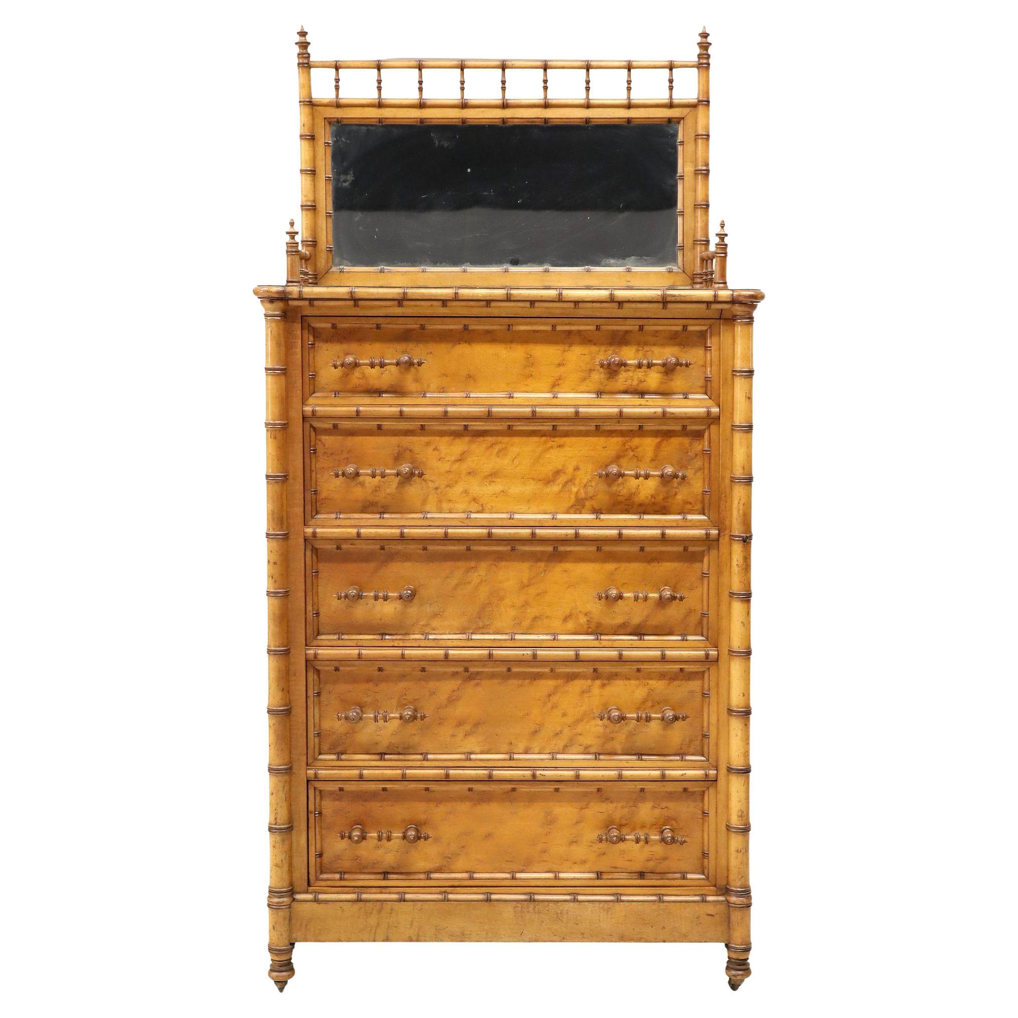 Late 19th Century American Bird's-Eye Maple Chiffonier/Chest of Drawers, attributed to R.J. Horner & Co., New York. This elegant tall chest features five graduated drawers adorned with turned bamboo-style pulls and rests on original brass