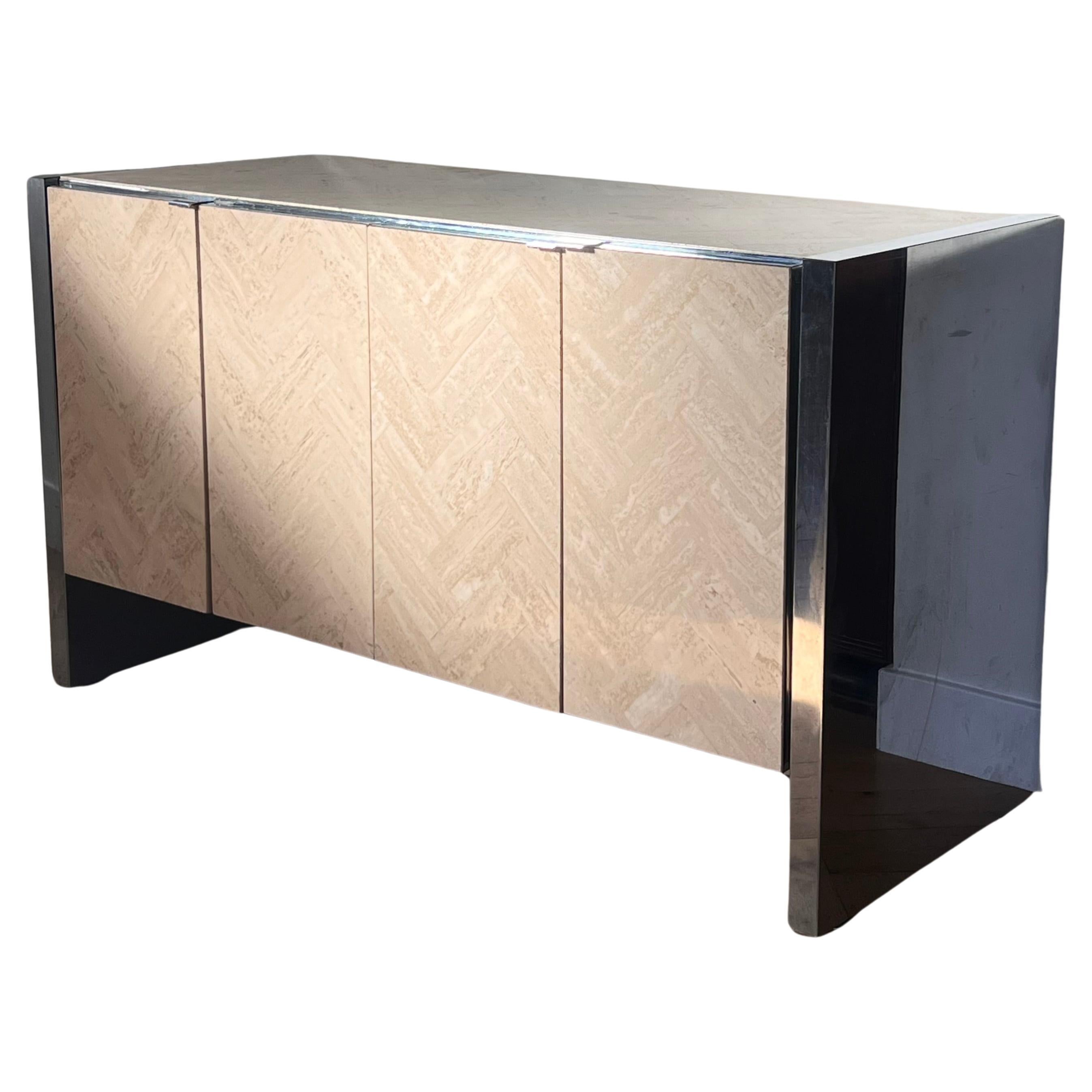 A very rare - and valuable - Italian travertine and chrome credenza by Ello Furniture, Italy circa 1970. This piece is pure Italian travertine with chrome sides, edging, and legs. The doors open outward to reveal clean interiors with multiple