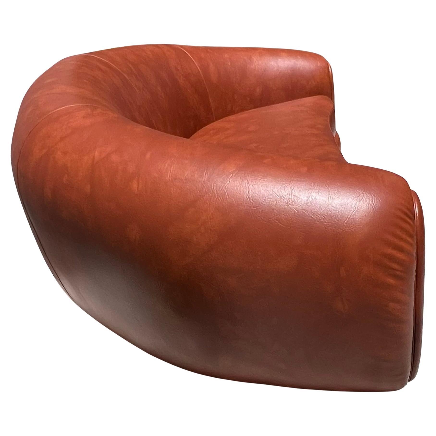 Jean Royère style curvy cognac pleather sofa, 21st century  For Sale