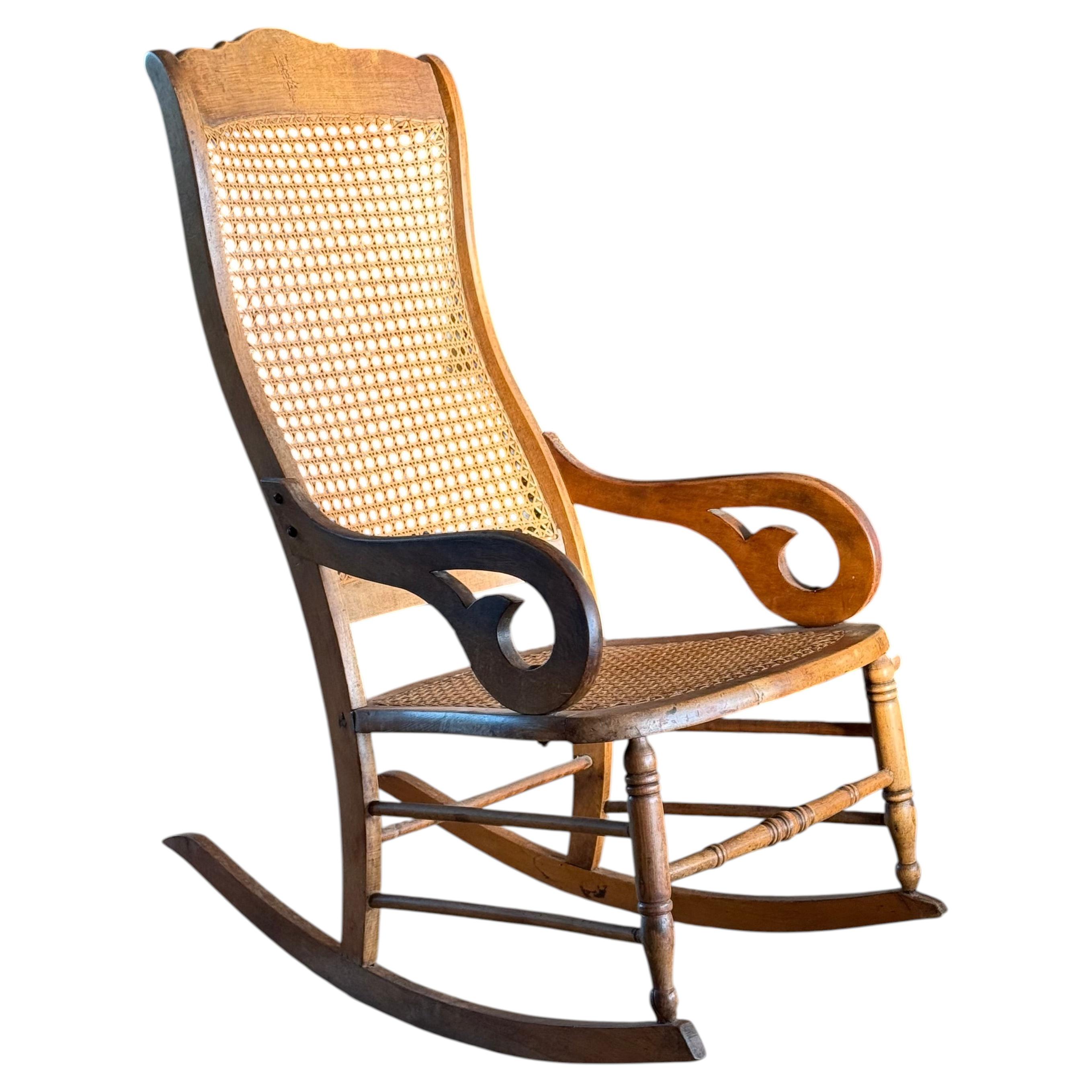 Antique wood and cane Lincoln rocking chair, 19th century For Sale