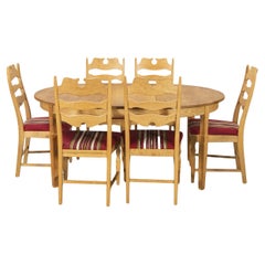 Scandinavian Modern extendable round Oak Dining Table by Henning Kjaernulf