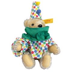 Orsacchiotto di peluche vintage Steiff a forma di clown con abito e cappello originali.