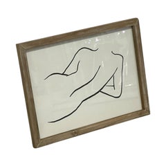Dibujo a línea de una figura desnuda tumbada, de estilo minimalista contemporáneo, en marco de madera.