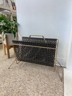 Mid-Century Modern Brass Toned and Black Enamel Metal Magazine Rack.