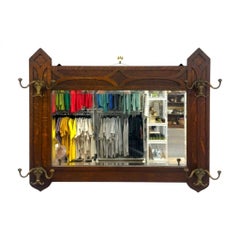 Antique Dark Oak Gothic Revival Hall Mirror with Brass Hooks.