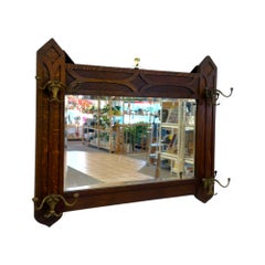Antique Dark Oak Gothic Revival Hall Mirror with Brass Hooks.