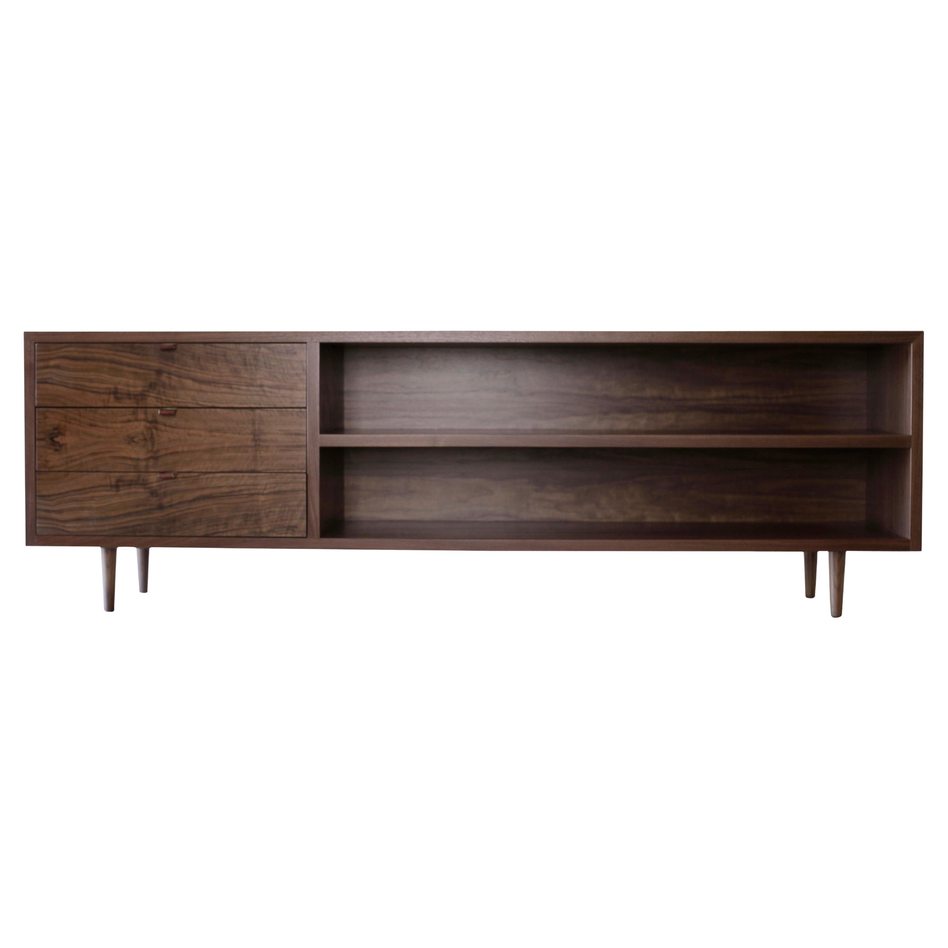 This Mid-Century inspired walnut sideboard was designed to provide extra storage in a client’s guest house here in Santa Fe. She loves midcentury design and the guest house has contemporary lines which we aimed to echo in this piece. The straight