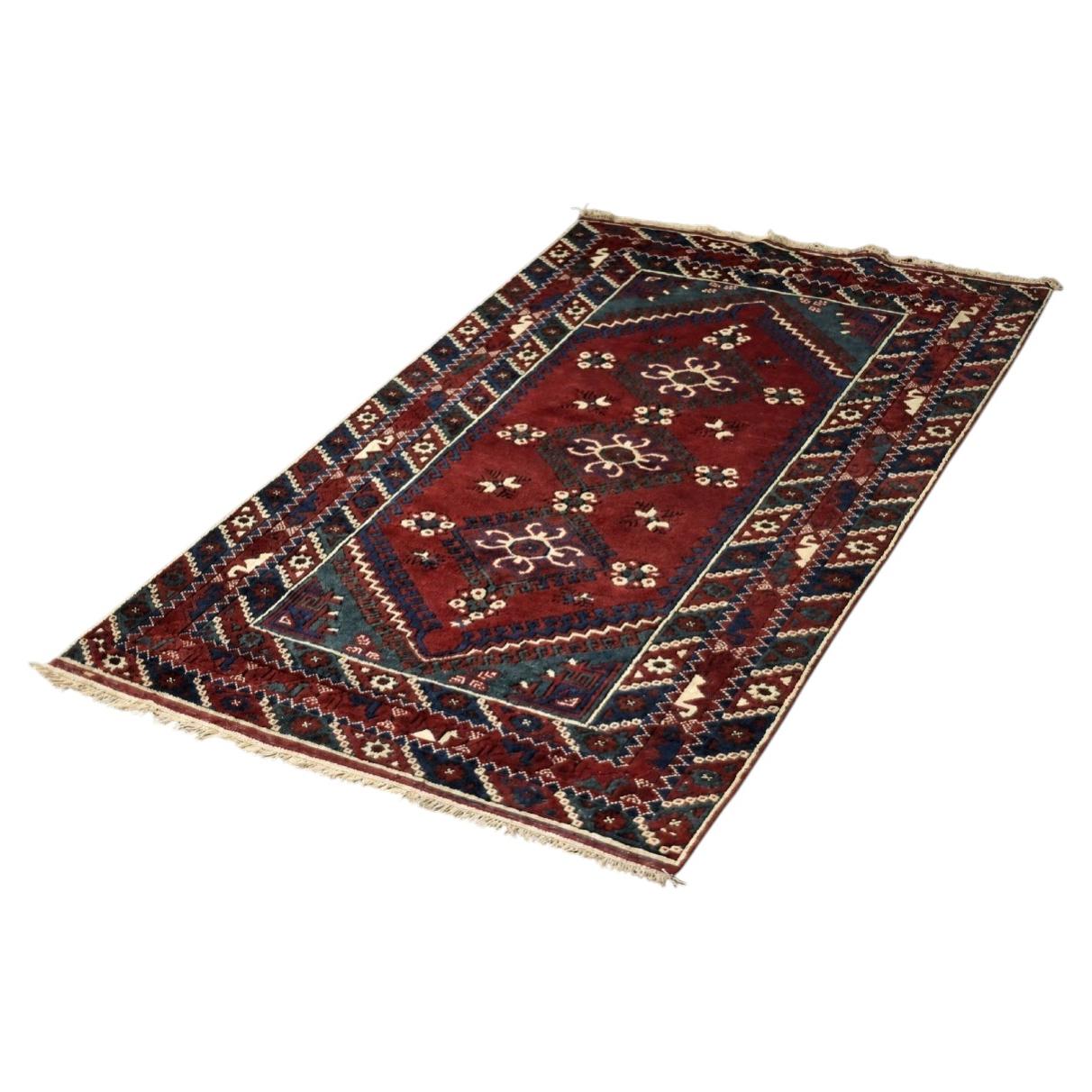 Tapis afghan oriental rouge tissé à la main, années 1970 en vente
