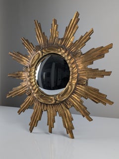 Konvexer Wandspiegel aus geschnitztem, vergoldetem Holz mit Sonnenstrahlen-Motiv, 1950er Jahre