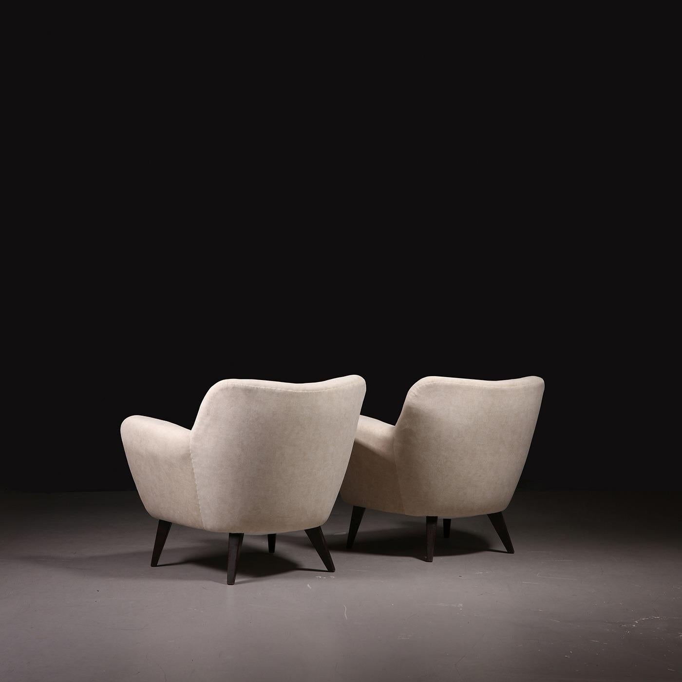 French cabinetmaker, pair of lounge chairs, fabric, wood, France, 1960s.

Date of manufacture: 1960s
Origin: France
Materials: Fabric, Wood
Dimensions: H 70 cm x W 82 cm x D 72 cm; SH 38 cm
Condition: The lounge chairs have recently been