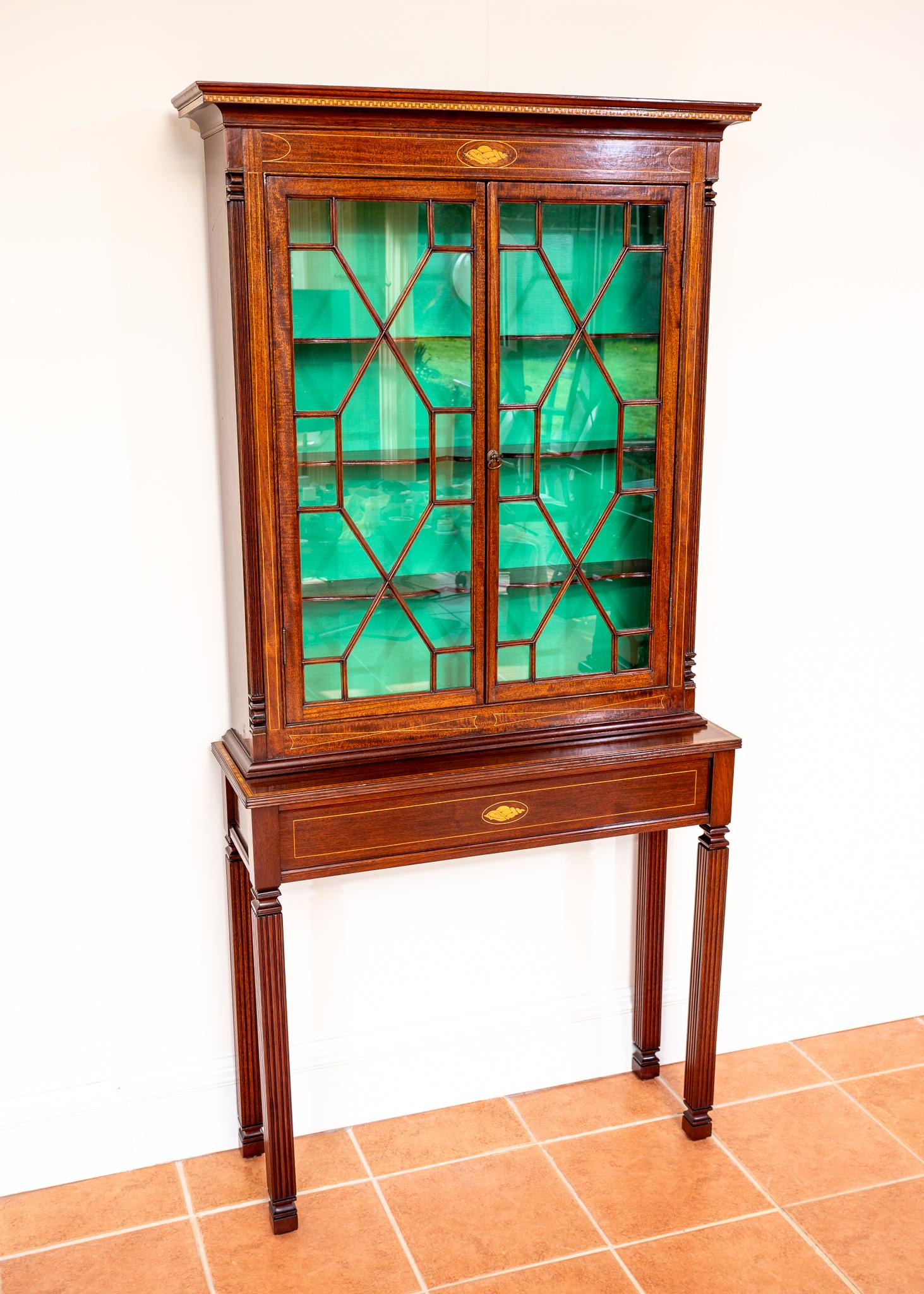 A gorgeous, impressive and very rare antique matching pair of inlaid mahogany Astragal glaze cabinet and console table in really lovely condition. Most likely made in England in the late Victorian / early Edwardian Art Nouveau period, this beautiful