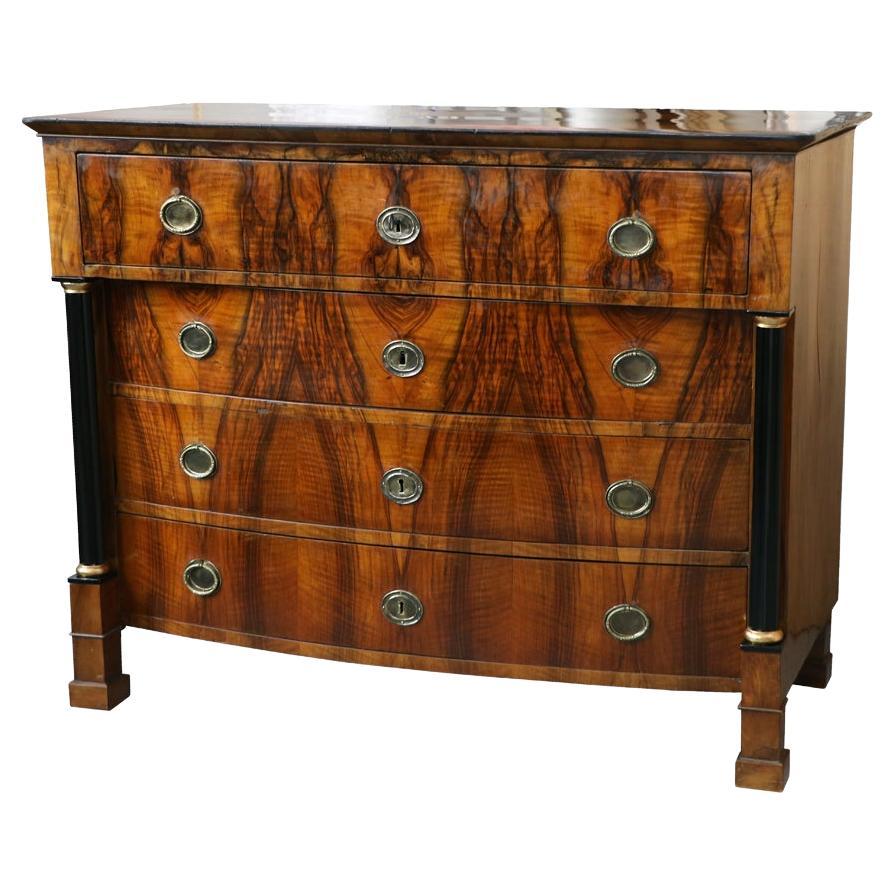 Hello,
We would like to offer you this truly exquisite, early Biedermeier walnut commode. The piece was made in Vienna circa 1825.

Viennese Biedermeier is distinguished by their sophisticated proportions, rare and refined design and excellent