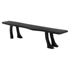 handmade Foot Bench in black with four legs, carved detail in black