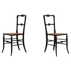 Pair of English victorian black lacquered gilt English side chairs, ca. 1850