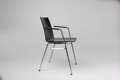 Mid-century modern black design chair in with armrests, Belgium
