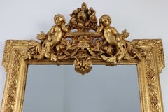 French rococo style richly sculpted gilted oak mirror, 19th century