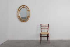 20th century neo-classical style tilted oval mirror by Deknudt, Belgium