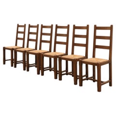 Set of 6 rustic oak ladder-back chairs with rush seats, France, 20th century
