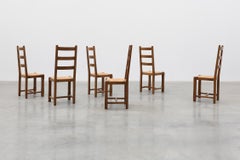 Set of 6 rustic oak ladder-back chairs with rush seats, France, 20th century