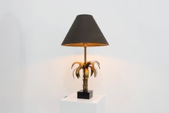Hollywood Regency brass palm tree table lamp with black shade, France, 1970s
