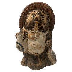 Japanese Shigaraki Pottery Tanuki Figurine with Sake Bottle and Straw Hat