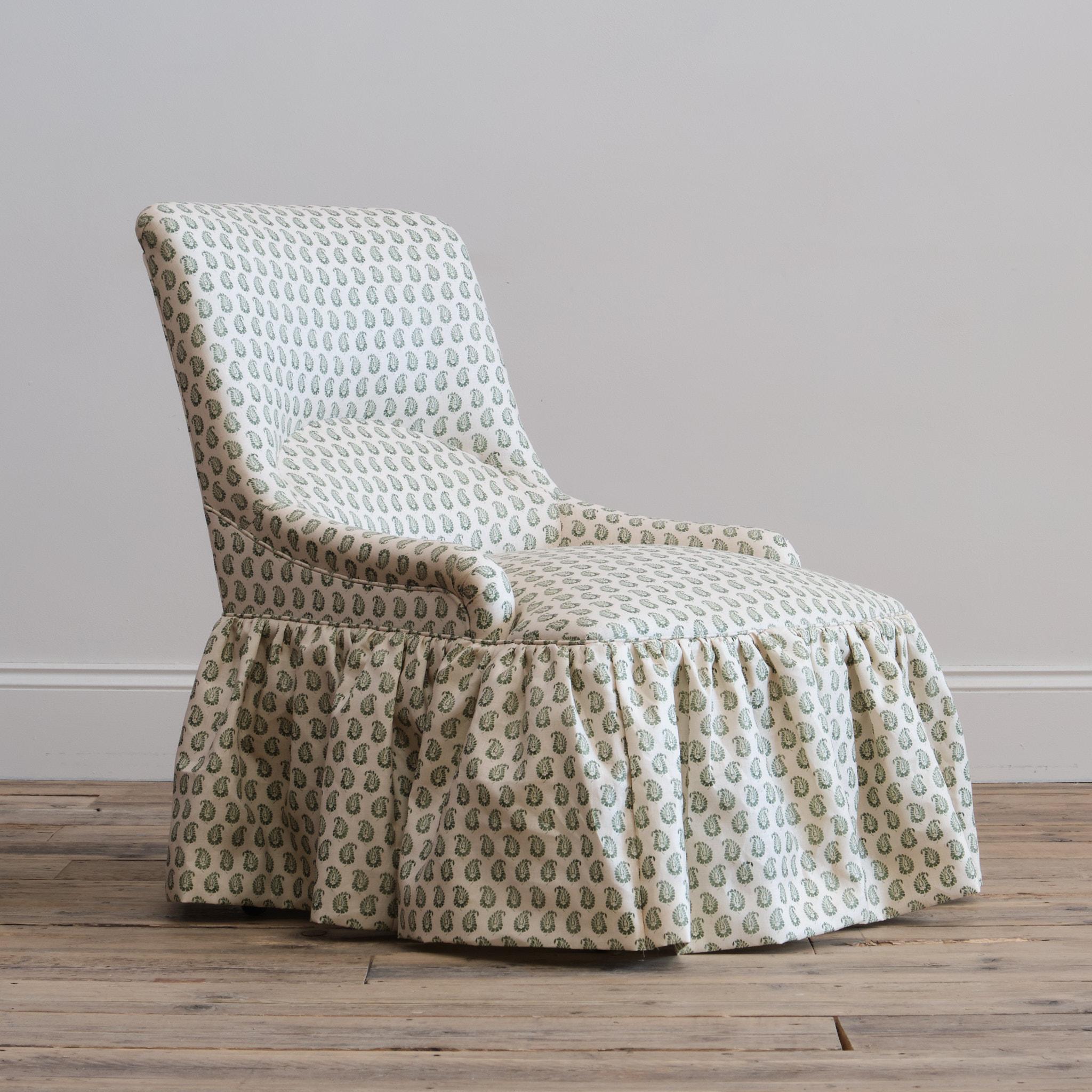 A good quality 19th century bedroom or nursing chair attributed to Gillows c1860. Newly upholstered by us in Howe 36 Bourne Street - Cypress Linen 'Olive'.

Raised on turned front legs and splayed rear legs. The legs painted in white which is