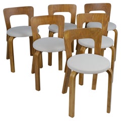 Satz von sechs Alvar Aalto Modell 65 Stühlen aus Birke und beigefarbenem Stoff,  Artek 1950er Jahre