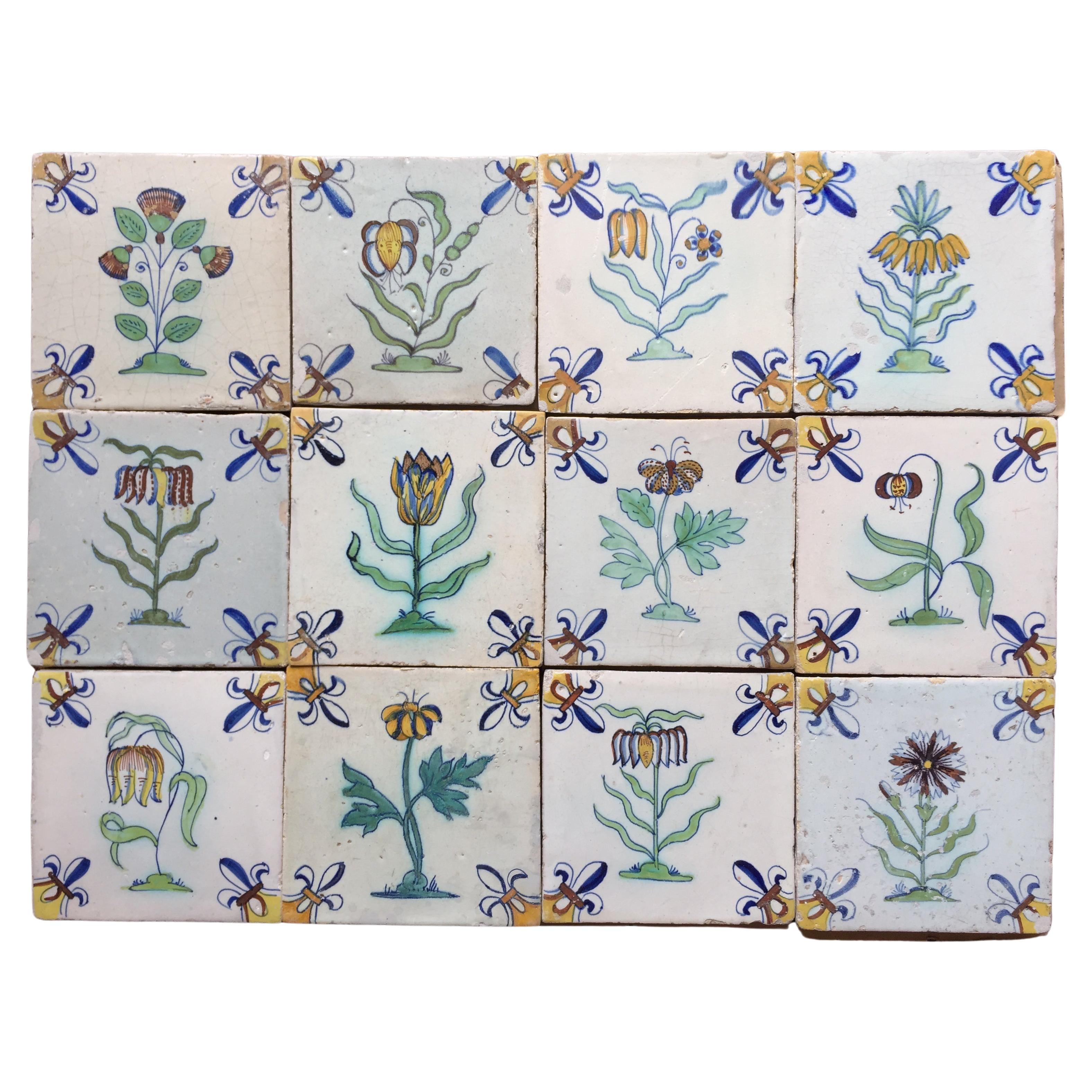 A rare set of 12 polychrome Dutch Delft tiles with flowers.
Made in The Netherlands.
Circa 1625 - 1650.

This set of tiles is of very fine quality and has a bright glaze. They date to the second quarter of the 17th century and where probably ment to