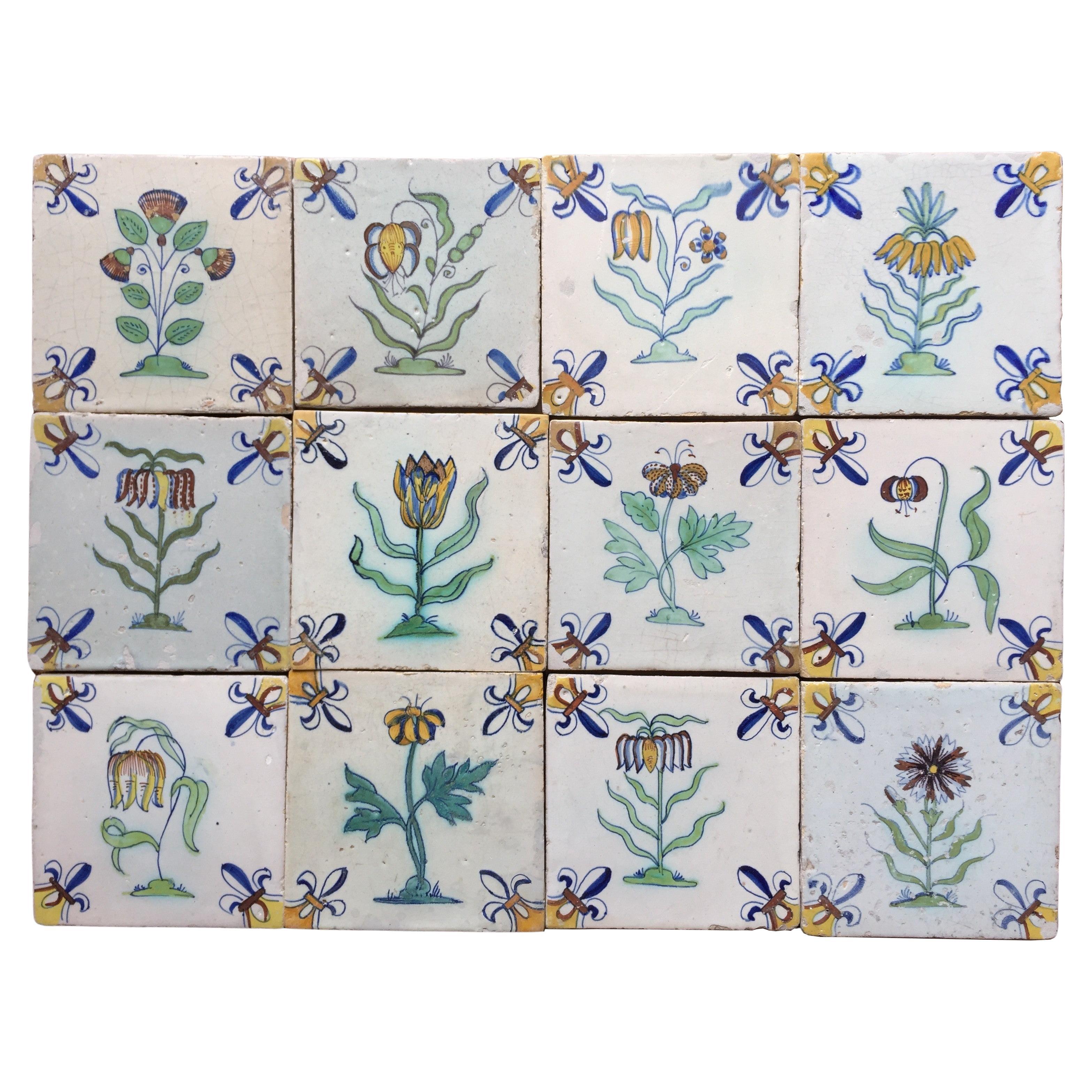 Conjunto de 12 azulejos policromos holandeses de Delft con flores