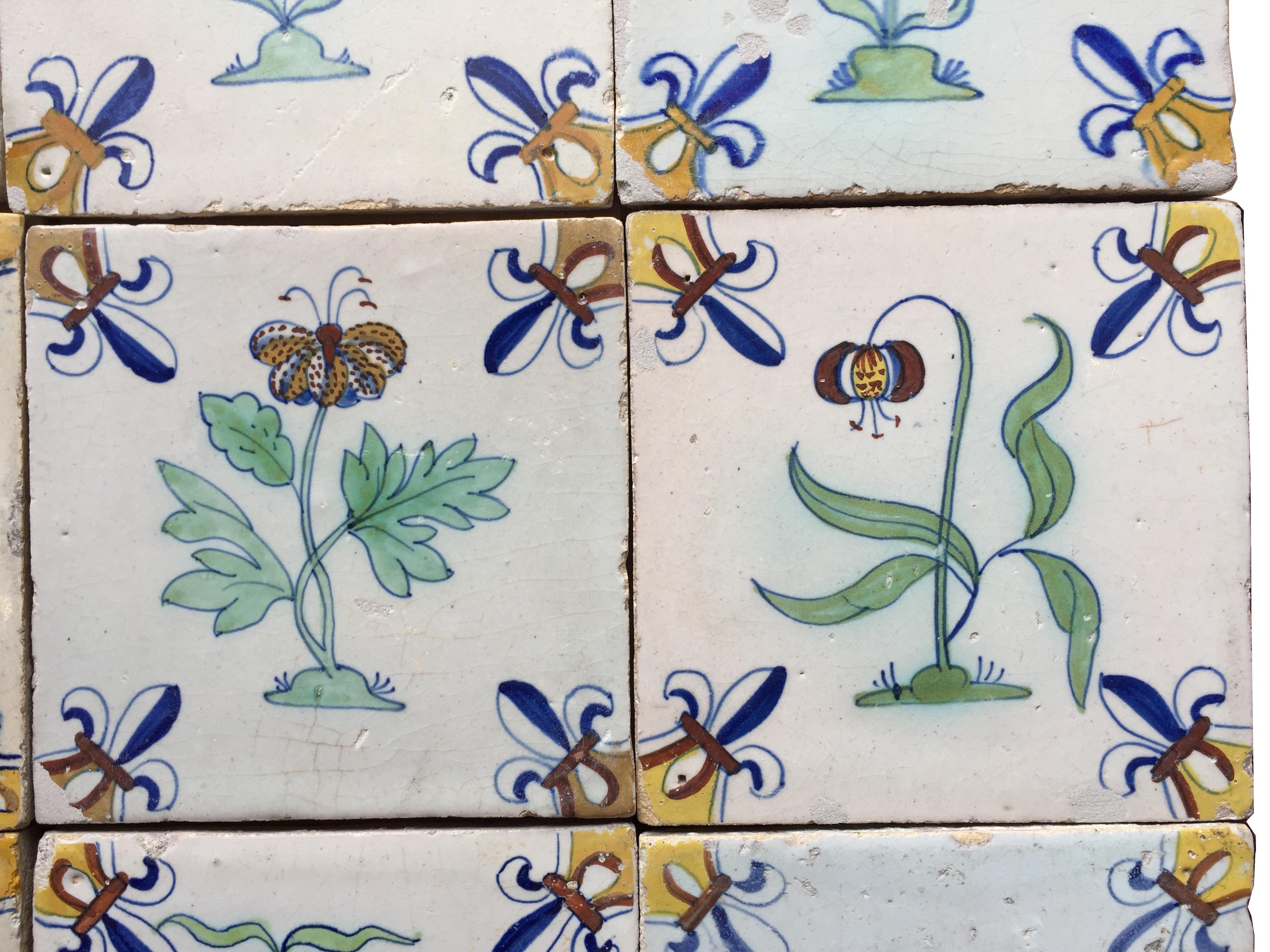 17th Century A set of 12 polychrome Dutch Delft tiles with flowers For Sale