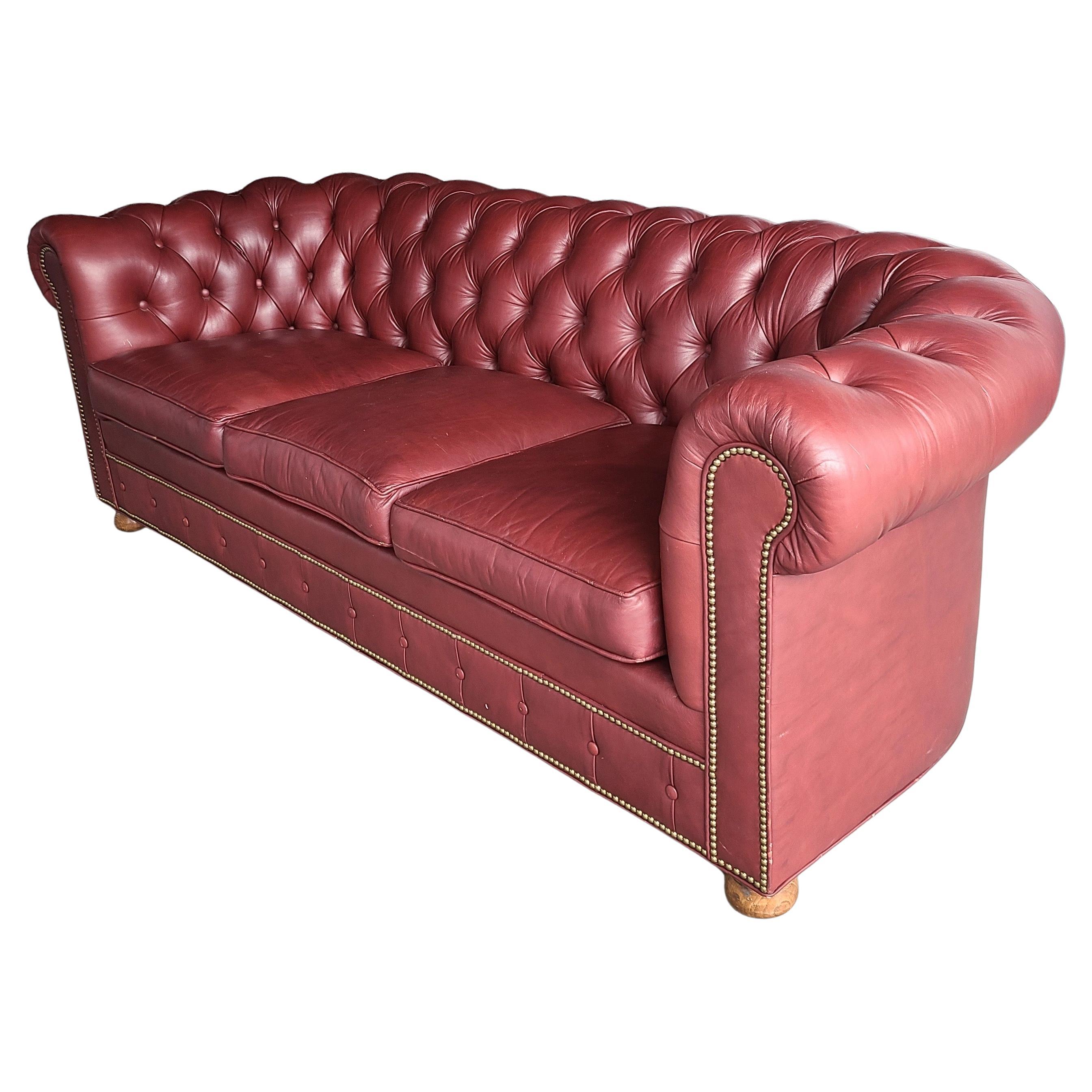 Please message us for a cost effective shipping quote to your location.

Button tufted leather Chesterfield Sofa by Alex Stuart Designs.
