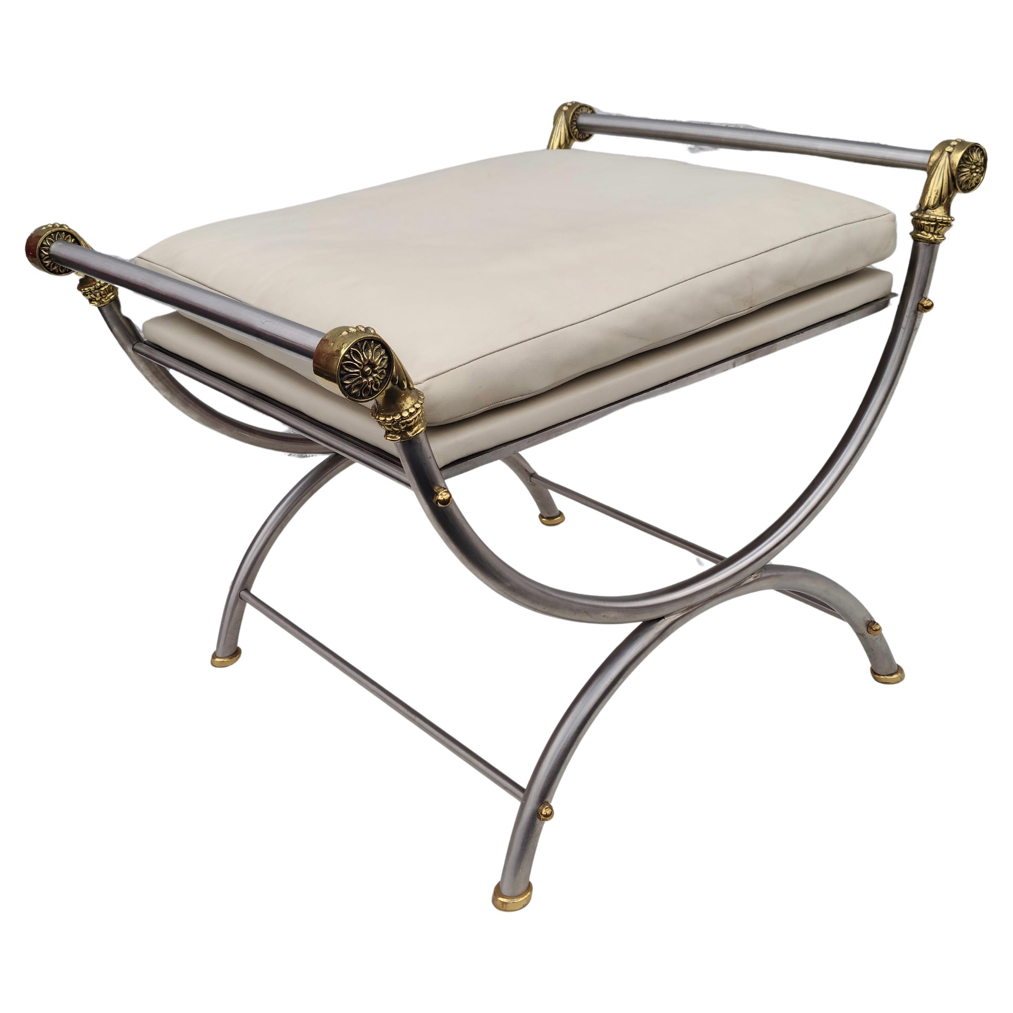 Campaign Bench attributed to Maison Jansen.
Leather seat, stainless steel frame, brass trim.