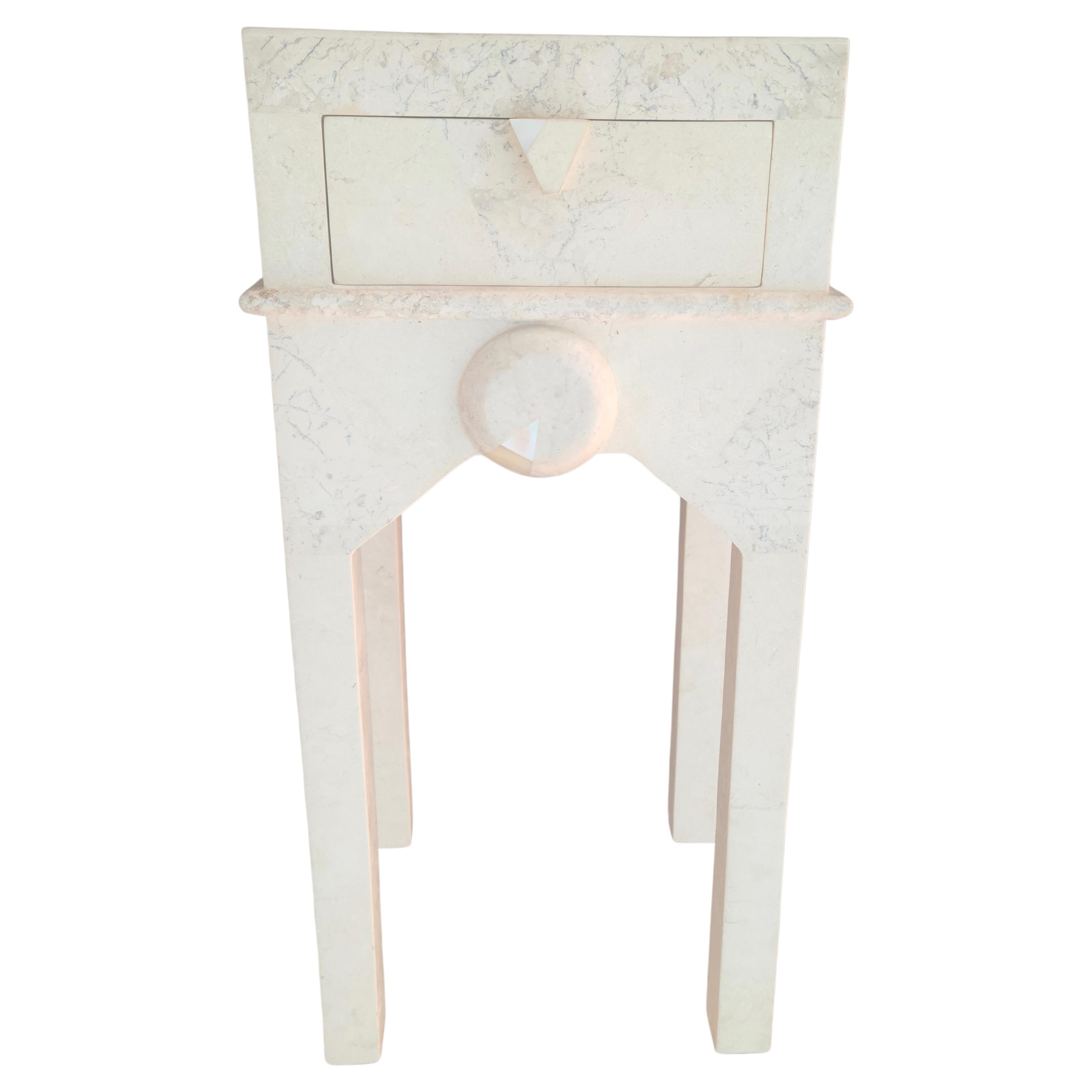 Please feel free to reach out for accurate shipping quote to your location.
This item is somewhat fragile. It may need a crate or in-home delivery depending on your location. 

Single drawer side table.
Tessellated Travertine Stone Surround.
