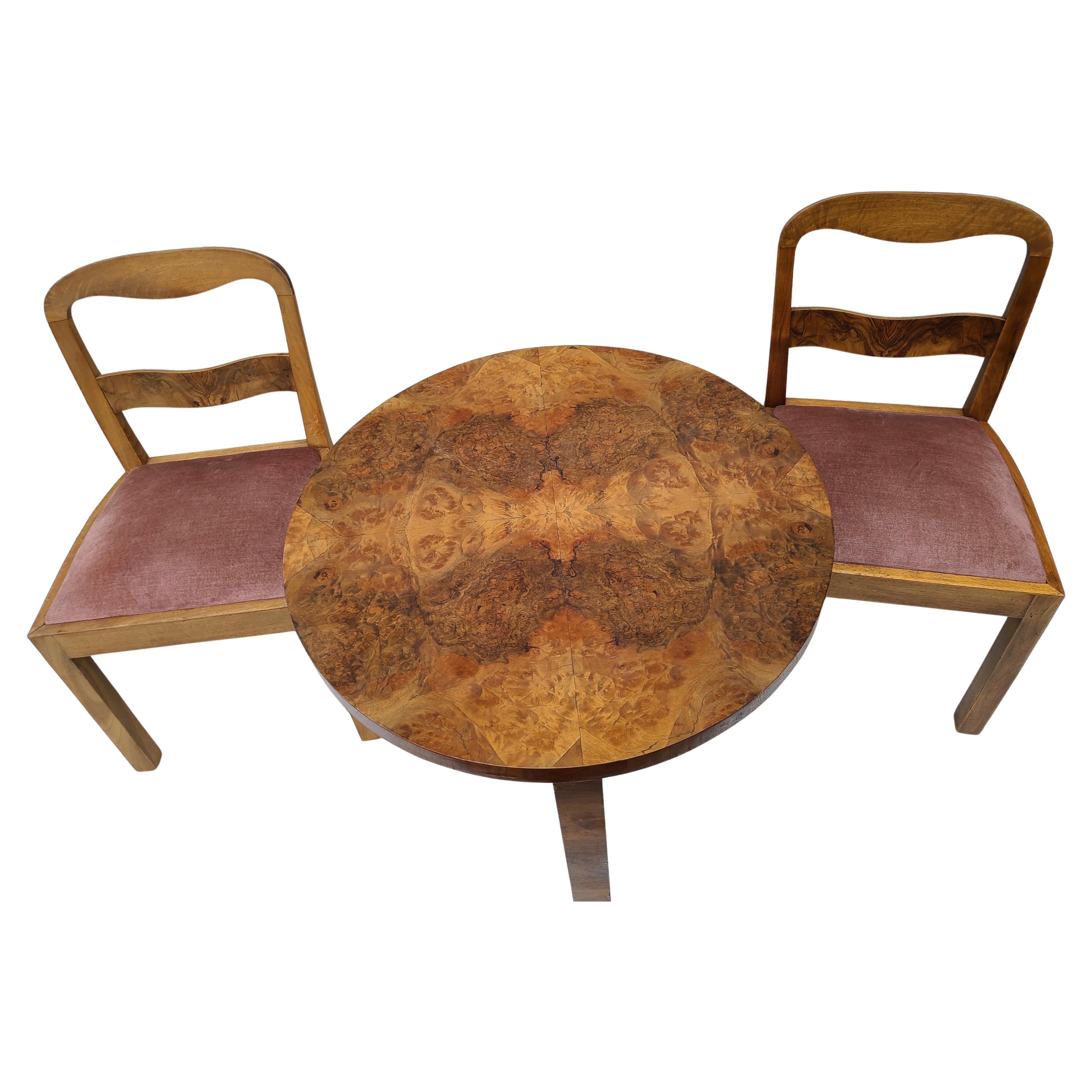 Streamline Deco Table and Chairs.
Walnut with Walnut Burl top. 
Pink Mohair seats.