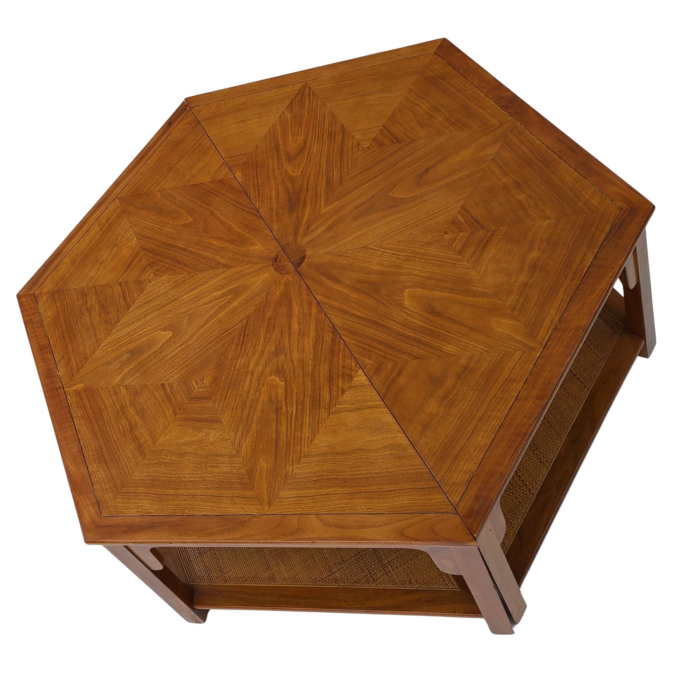 Please feel free to reach out for efficient shipping quote to your location.

Hexagon Coffee table by Baker Furniture.
Designed by Winsor White for Pacific Northwest line.
Clever two piece ensemble. 
Walnut and Cane.